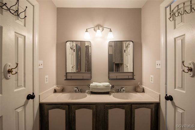 Bathroom featuring double vanity and a sink | Image 20