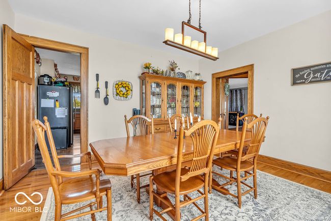 dining space featuring light wood-style floors and baseboards | Image 27