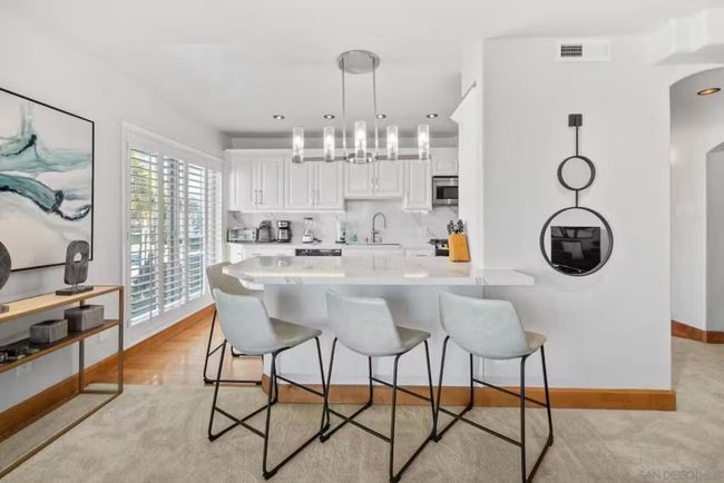 Looking from the living room toward the spacious and open kitchen. | Image 9