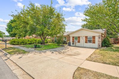 View of front facade with a front lawn and cooling unit | Image 3