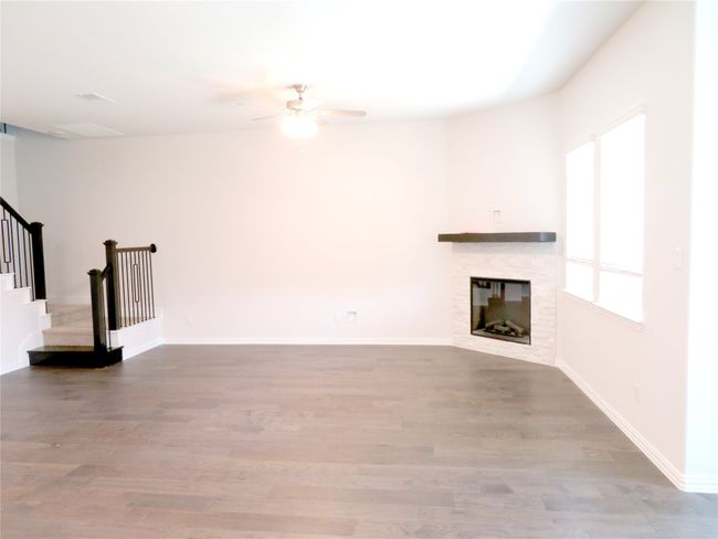 Family room is with the open kitchen area and the breakfast area | Image 9