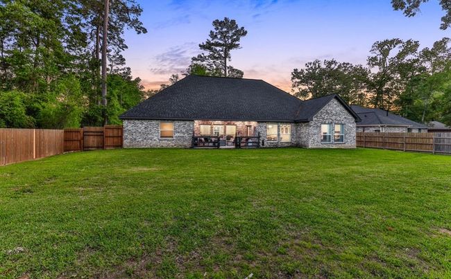 Rear of the home with plenty of room for a pool | Image 44