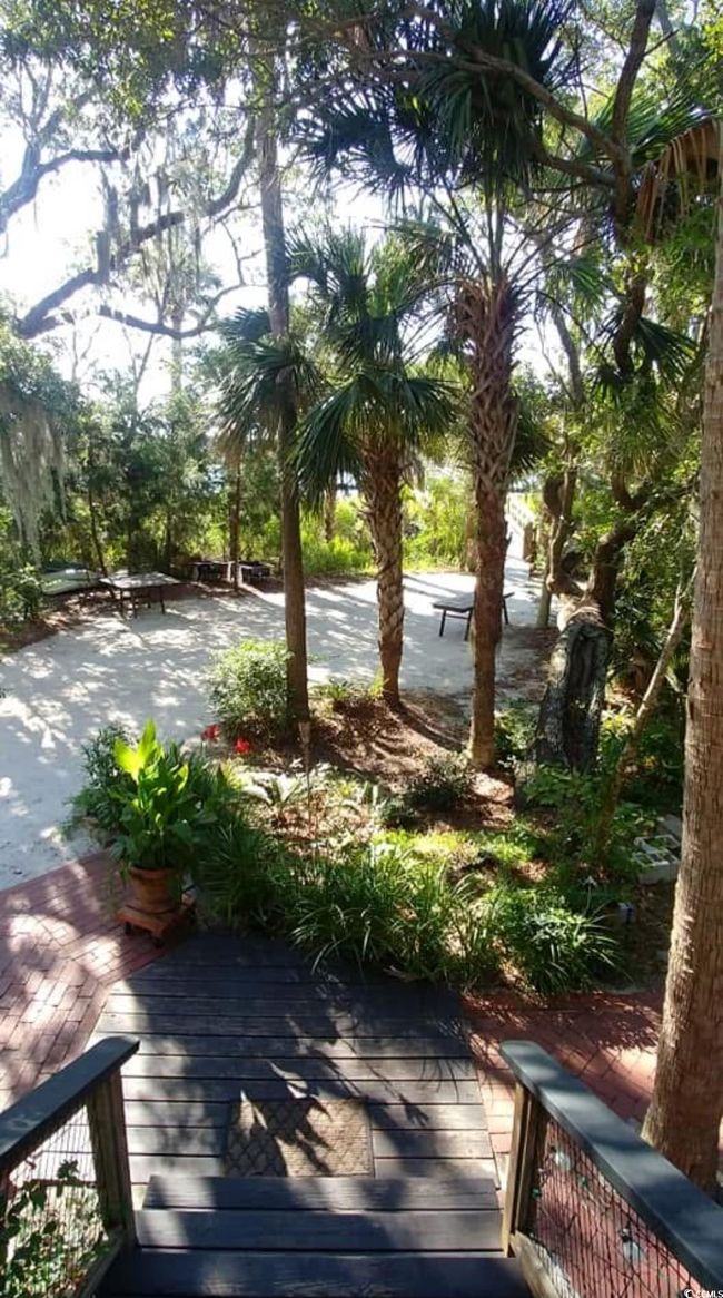 View of property's community featuring a wooden deck | Image 20