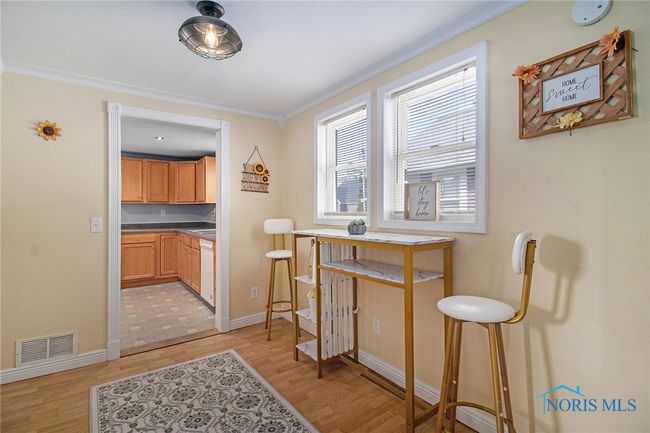 Dining room area, perfect for both everyday dinners and special occasions. With its welcoming ambiance, easy flow from the kitchen | Image 10