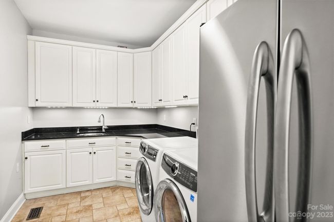 Laundry room with second fridge | Image 28