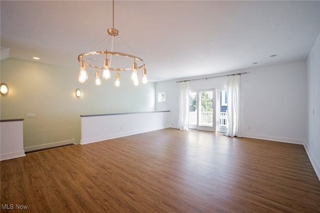 Unfurnished room featuring a chandelier, recessed lighting, baseboards, and wood finished floors | Image 8