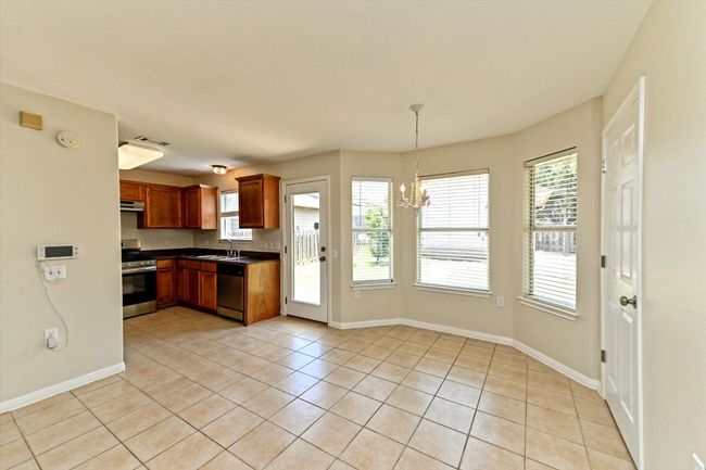 Casual dining area is spacious and inviting. | Image 14