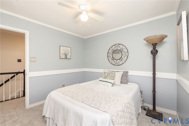 Bedroom featuring carpet flooring, ornamental molding, and ceiling fan | Image 27