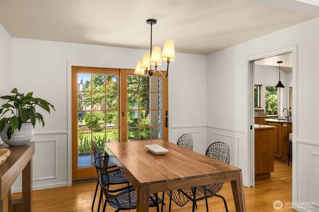 Enjoy dinner framed by garden views in a dining space that blends indoor elegance with outdoor beauty. | Image 8