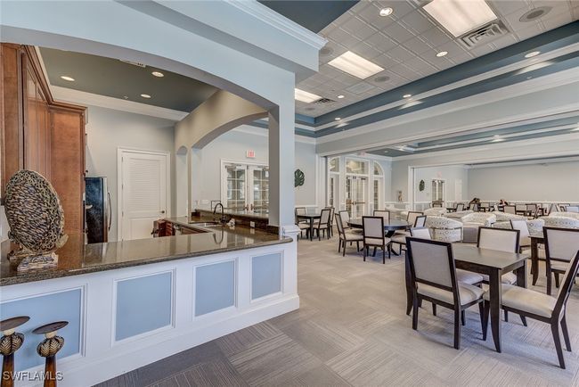 Welcome area with arched walkways, french doors, a sink, and visible vents | Image 35