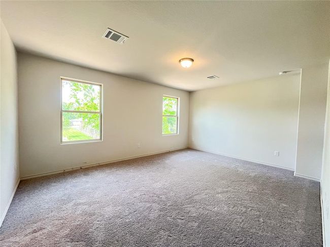 Cozy upstairs master bedroom with plush carpeting. | Image 14