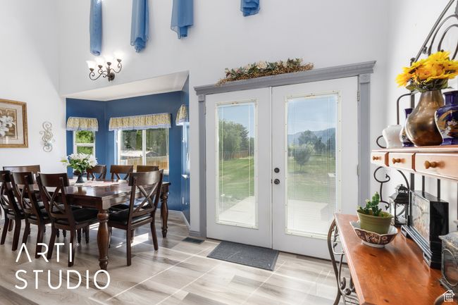 Dining room featuring french doors and a high ceiling | Image 16