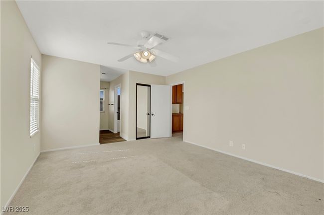 Unfurnished bedroom featuring light carpet, ceiling fan, and baseboards | Image 24