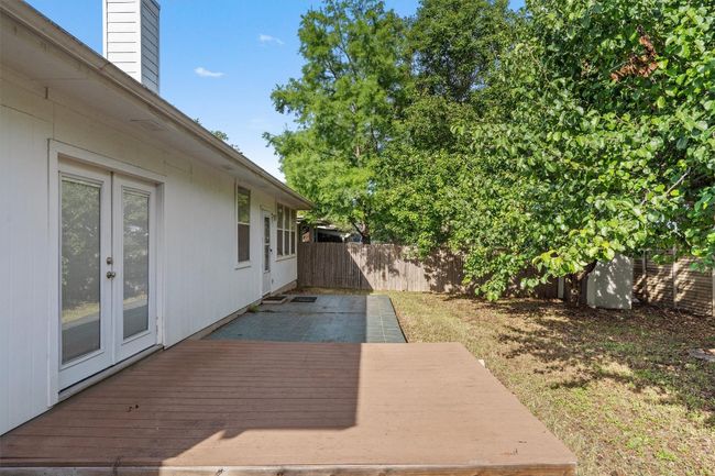 Wooden deck featuring french doors and a fenced backyard | Image 35