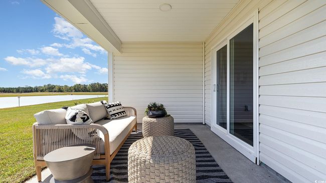 View of patio with a water view and outdoor lounge area | Image 27