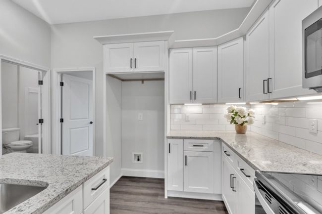 The guest bedroom is conveniently located just off the kitchen. | Image 11