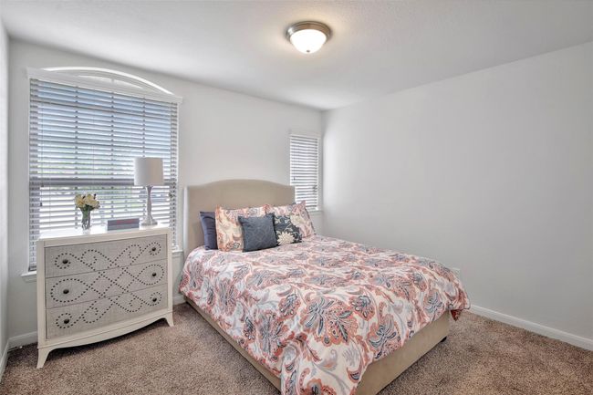 Bedroom with carpet floors and baseboards | Image 18