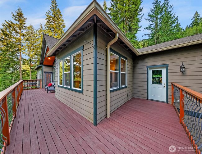 Showing the access to the deck from the garage and the primary bedroom on the other side | Image 29