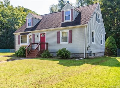 Cape cod house with a front yard | Image 1