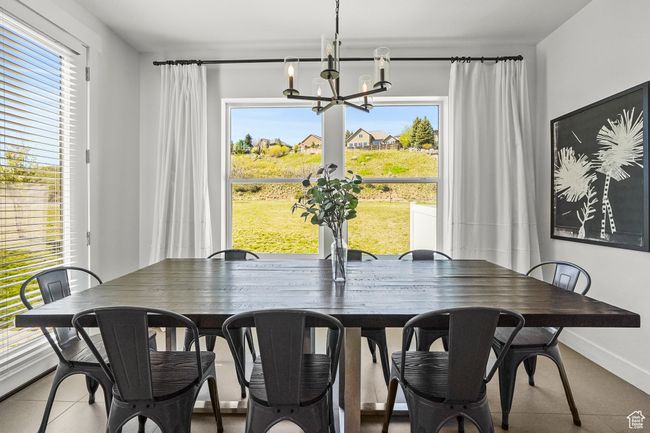 Dining room featuring a chandelier and baseboards | Image 15