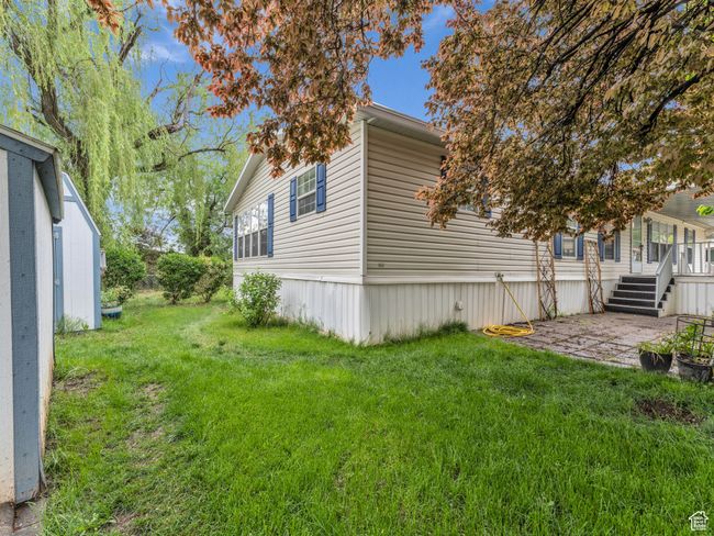 View of home's exterior with a yard and a patio | Image 26