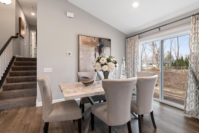 (Photo of decorated model, actual home's finishes will vary) Sliding doors an an abundance of light into the dinning area! | Image 10