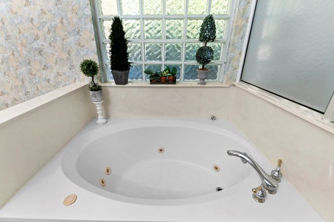 Bathroom with a bath | Image 25