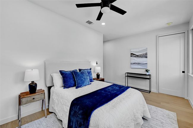 Bedroom with ceiling fan and light hardwood / wood-style floors | Image 4