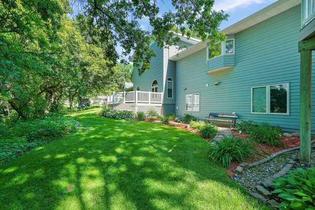 Extensive hardscapes in this amazing yard! Paver pathways, stone retaining walls and patios. | Image 43
