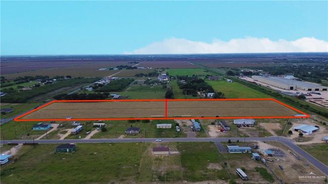 Aerial view of sparsely populated area featuring property parcel outlined | Image 6