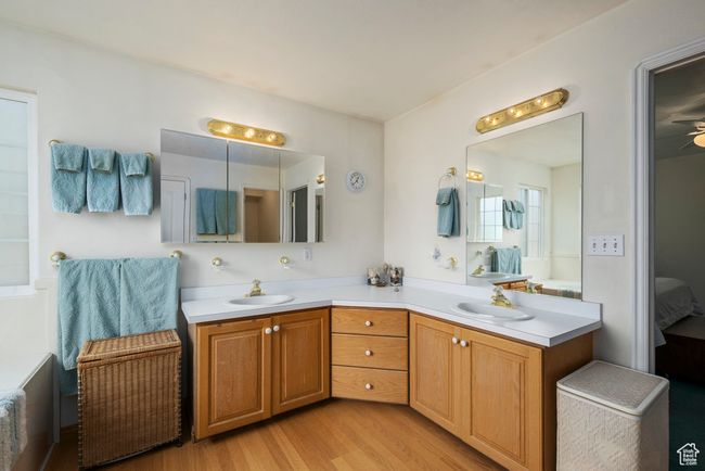 Full bath with wood finished floors, a sink, ensuite bath, and double vanity | Image 26