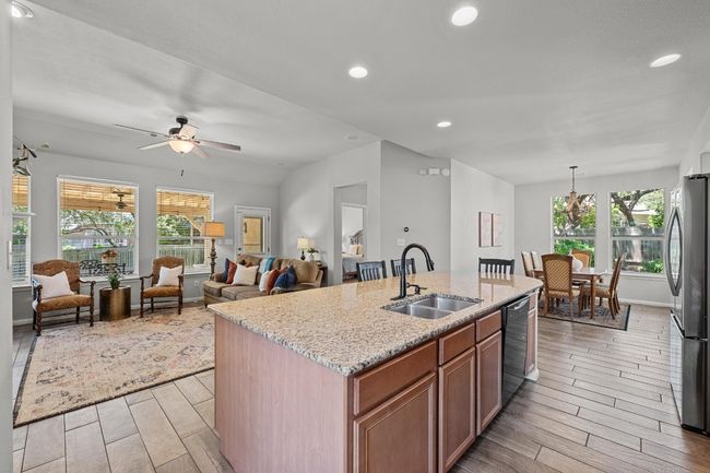 Large kitchen island that open to living room. | Image 5