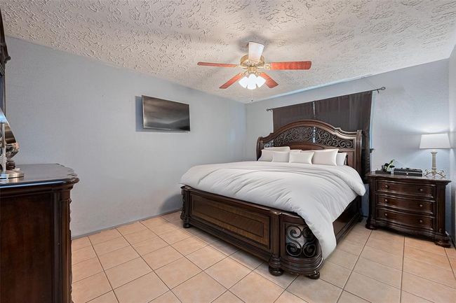 Primary bedroom allows for king sized bedroom set with additional space for more furniture. | Image 12