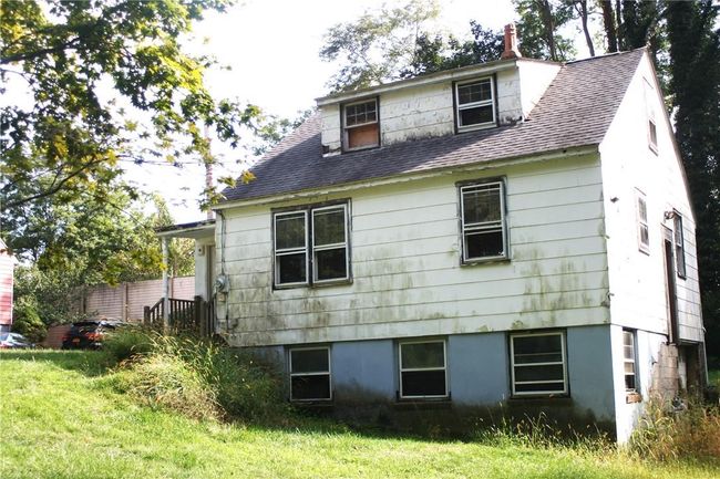 Rear view of house with a lawn | Image 7