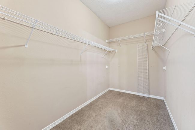 Huge walk-in closet with shelves | Image 28