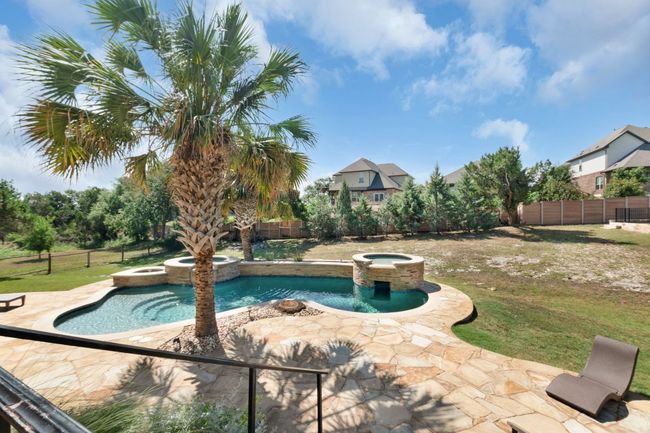 View of pool featuring a pool with connected hot tub and a patio area | Image 30