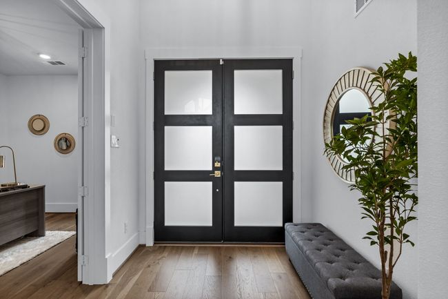Foyer with wood-type flooring and french doors | Image 5
