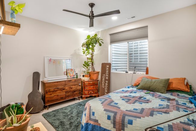 Tiled bedroom with visible vents and ceiling fan | Image 43
