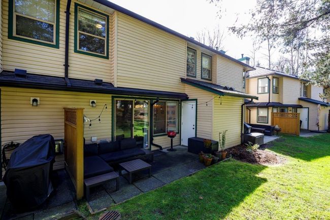 Rear view of house featuring a yard and a patio | Image 16