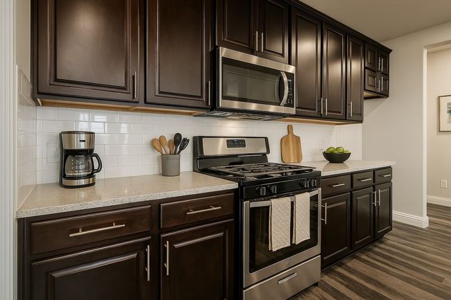 Kitchen featuring tasteful backsplash, dark wood-style flooring, baseboards, and stainless steel appliances | Image 8