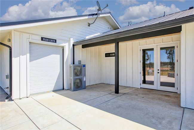 Back Patio with roll up door to 3rd car garage | Image 8