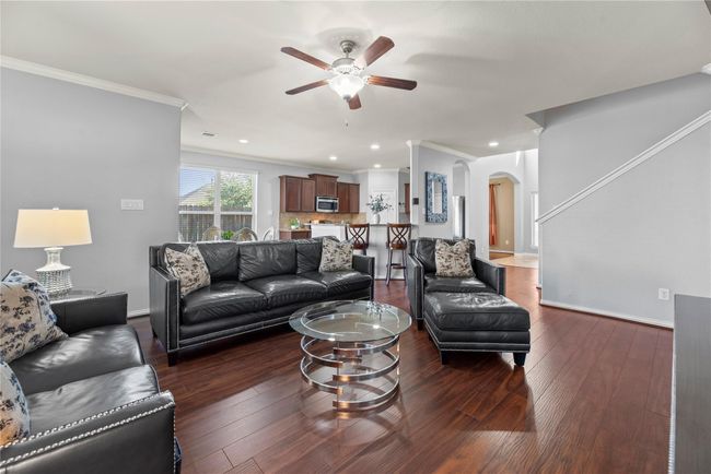 Truly open concept, the family room has clear sights to both the dining area and kitchen. Whether entertaining guests or keeping an eye on the littles, this layout delivers for modern needs and desires. | Image 10