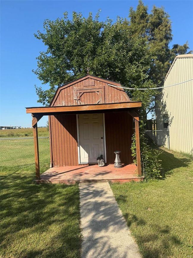View of outbuilding with a lawn | Image 22