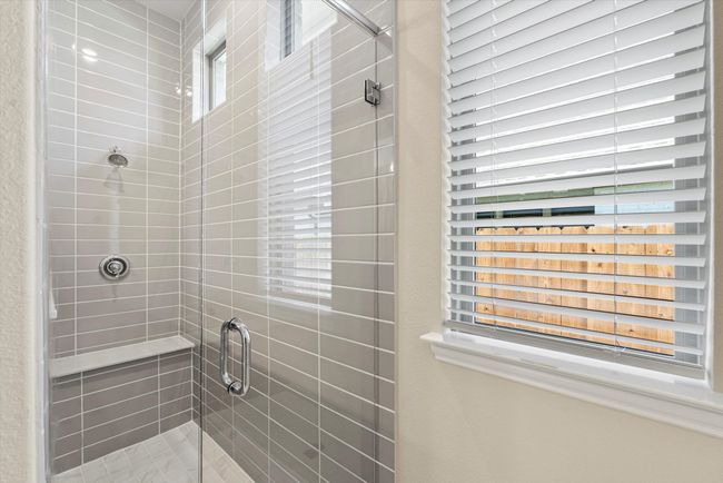 Bathroom featuring a shower stall. | Image 14