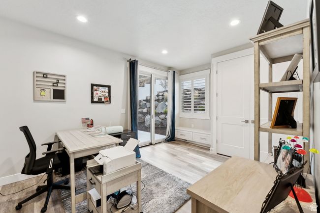 Home office featuring recessed lighting and light wood-style flooring | Image 20