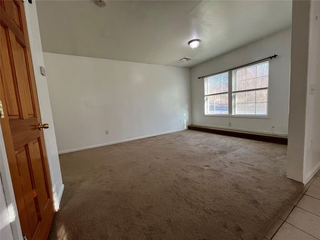 Coat closet door in living room | Image 8