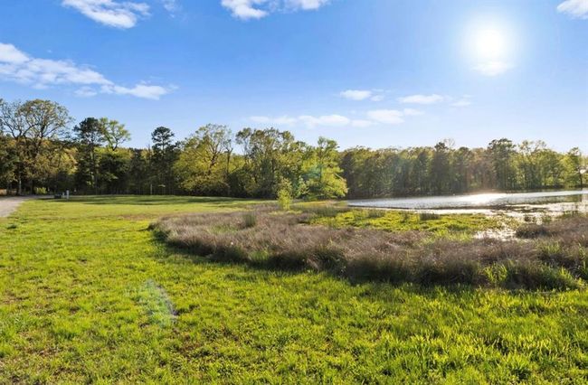 View of yard featuring a view of trees and a water view | Image 22