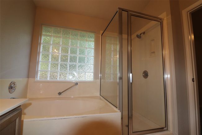 Bathroom with vanity, a garden tub, and a shower stall | Image 31