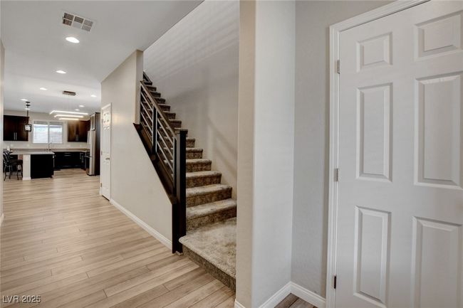 Stairs featuring wood finished floors, baseboards, and recessed lighting | Image 4