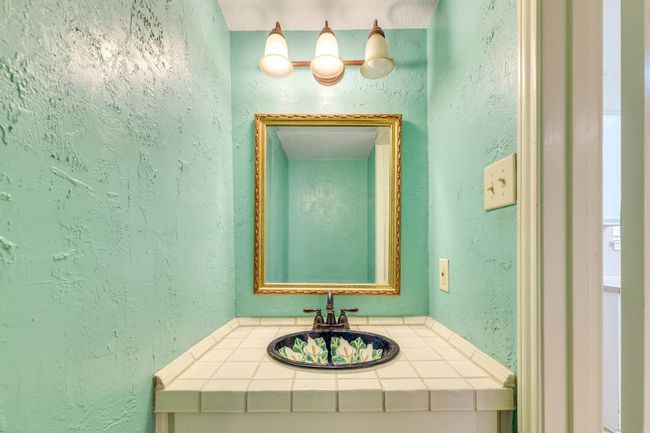 Half bathroom downstairs with Talavera sink. | Image 11